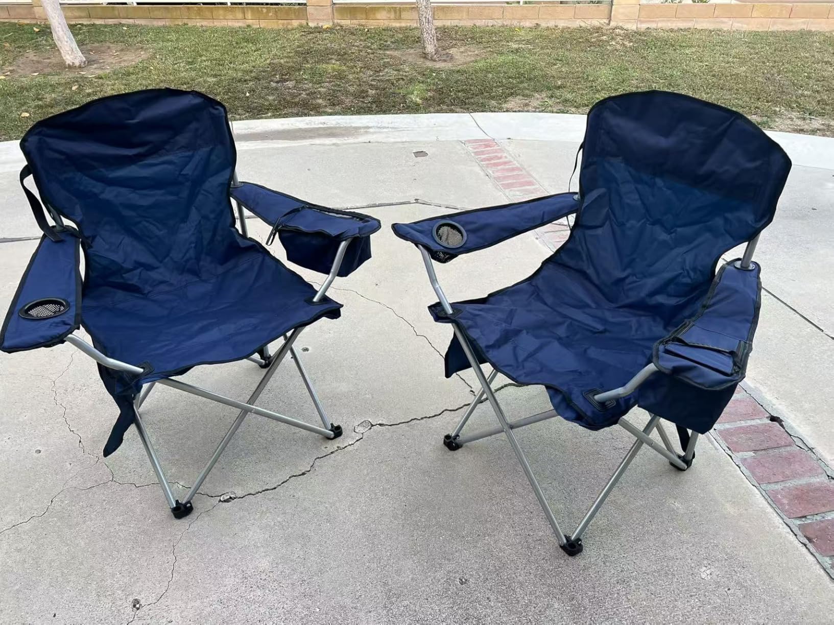 Set of two camping or beach fold-up chairs with cup-holders